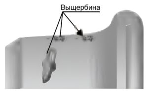 трещины или расслоение в выщербине, идущее вглубь металла
